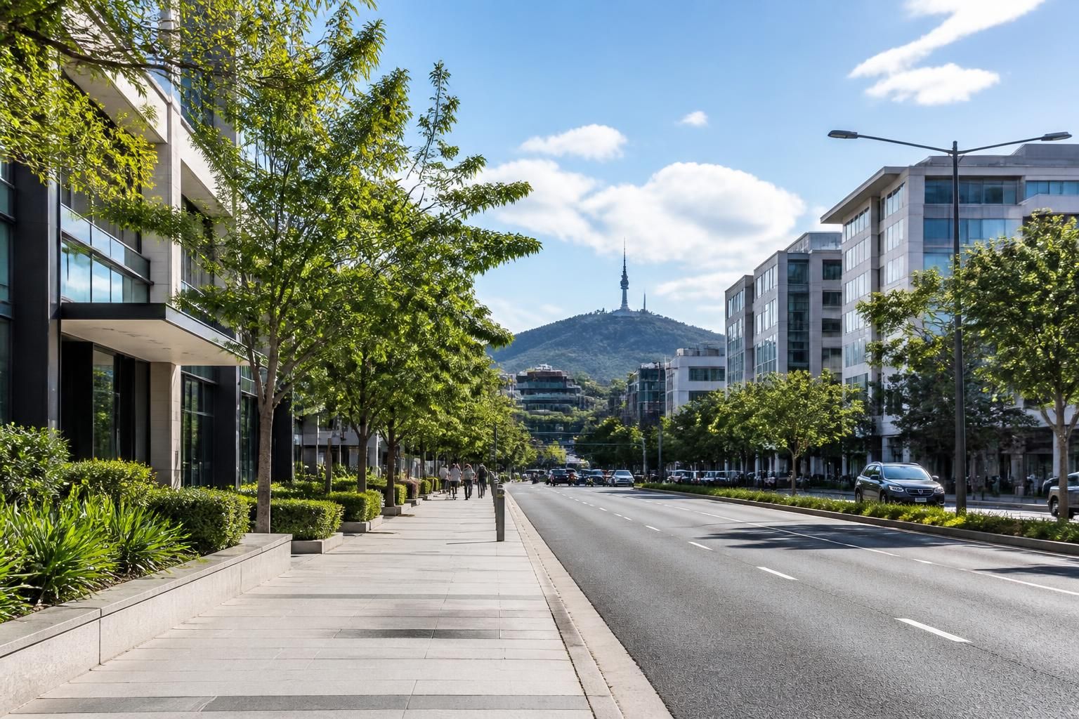 Clean city streetscape with modern buildings and a clear road.